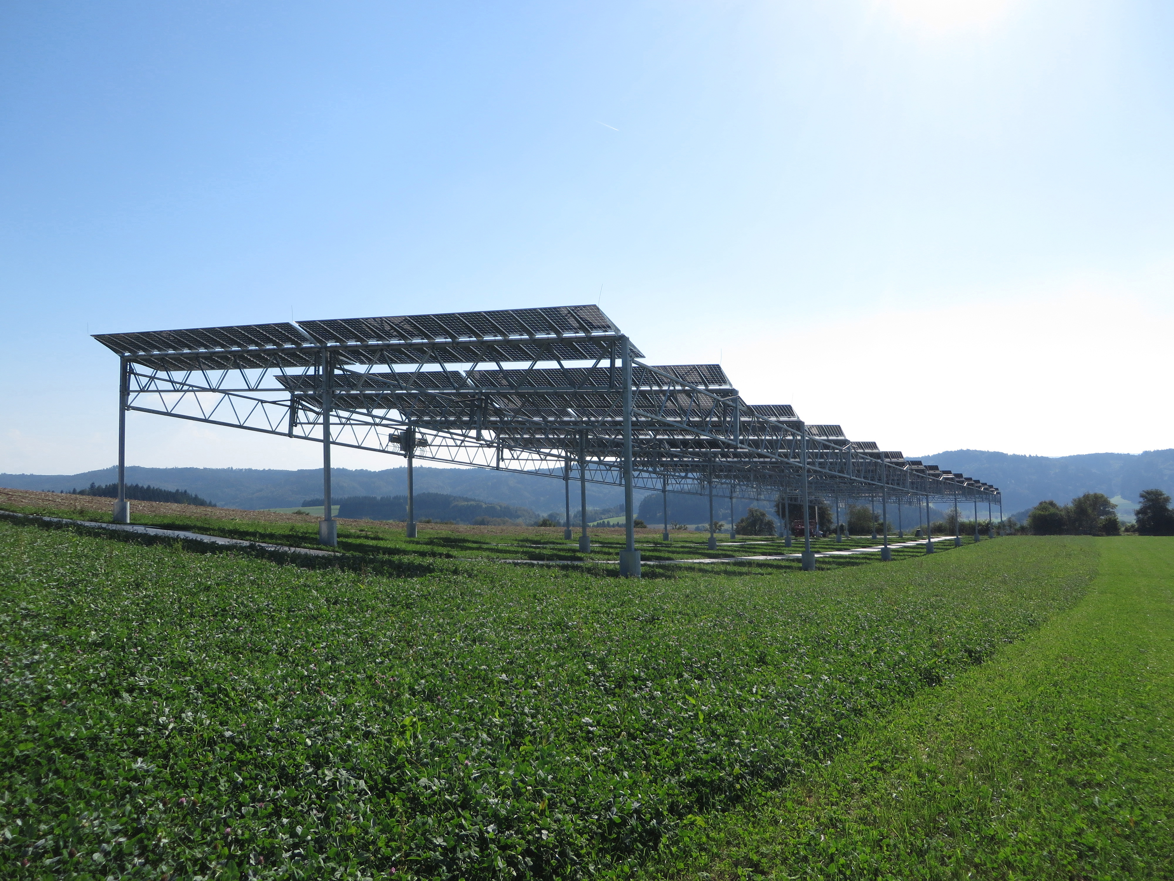 Agrophotovoltaics combines agricultural production and electric energy generation by photovoltaics on the same piece of land. The pilot installation in Heggelbach near Lake Constance, Germany is shown here. 